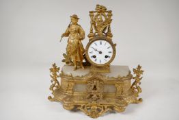 A French ormolu and alabaster mantel clock with enamel dial and Roman numerals, surmounted by a