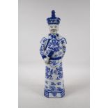 A blue and white porcelain figure of Chinese dignitary, impressed seal mark to base, 17" high