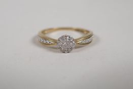 A 9ct yellow gold and diamond set cluster ring, approx 25 points, size R