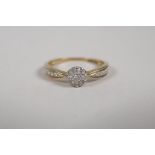 A 9ct yellow gold and diamond set cluster ring, approx 25 points, size R