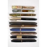 A collection of Waterman fountain pens to include two USA made and two Canadian made, all appear