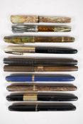 A collection of Waterman fountain pens to include two USA made and two Canadian made, all appear