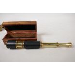 A two draw brass telescope, 13" long extended, in a hardwood box