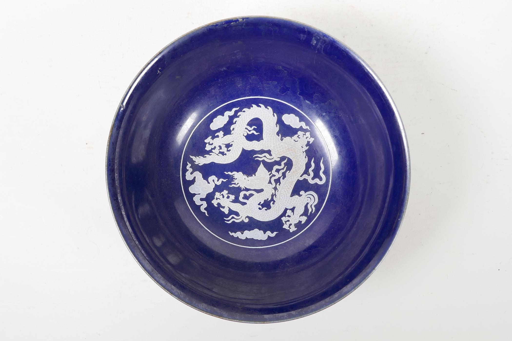 A powder blue glazed porcelain rice bowl with white enamel dragon decoration, six character mark - Image 3 of 6