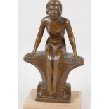 An Art Deco bronzed spelter figure of a seated female nude, 7" high