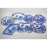 Seven pieces of C19th blue and white pottery, 'Boy on a Buffalo' pattern, to include a shaped