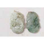 A jade pendant carved with kylin, 1" long, together with another carved with a monkey