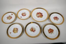 A Bavarian porcelain seven piece fruit service painted with various fruit and nuts, 10" serving