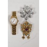 A lady's Michael Kors gold plated steel wrist watch, a vintage gilt metal brooch set with semi