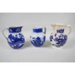 An early C19th blue and white pottery jug decorated in the Pagoda pattern, 5" high, together with