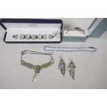 A delicate unmarked silver and green hardstone suite of necklace and earrings, together with a