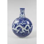 A Ming style blue and white porcelain moon flask with dragon decoration, incised Chinese four