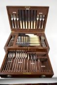 An oak cased canteen of Mappin and Webb silver plated rattail cutlery, missing carving knife and