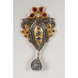 A silver gilt pendant set with uncut diamonds, rubies and sapphire, en suite to previous lot, 2"