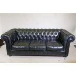 A black leather three seater Chesterfield, 78" long