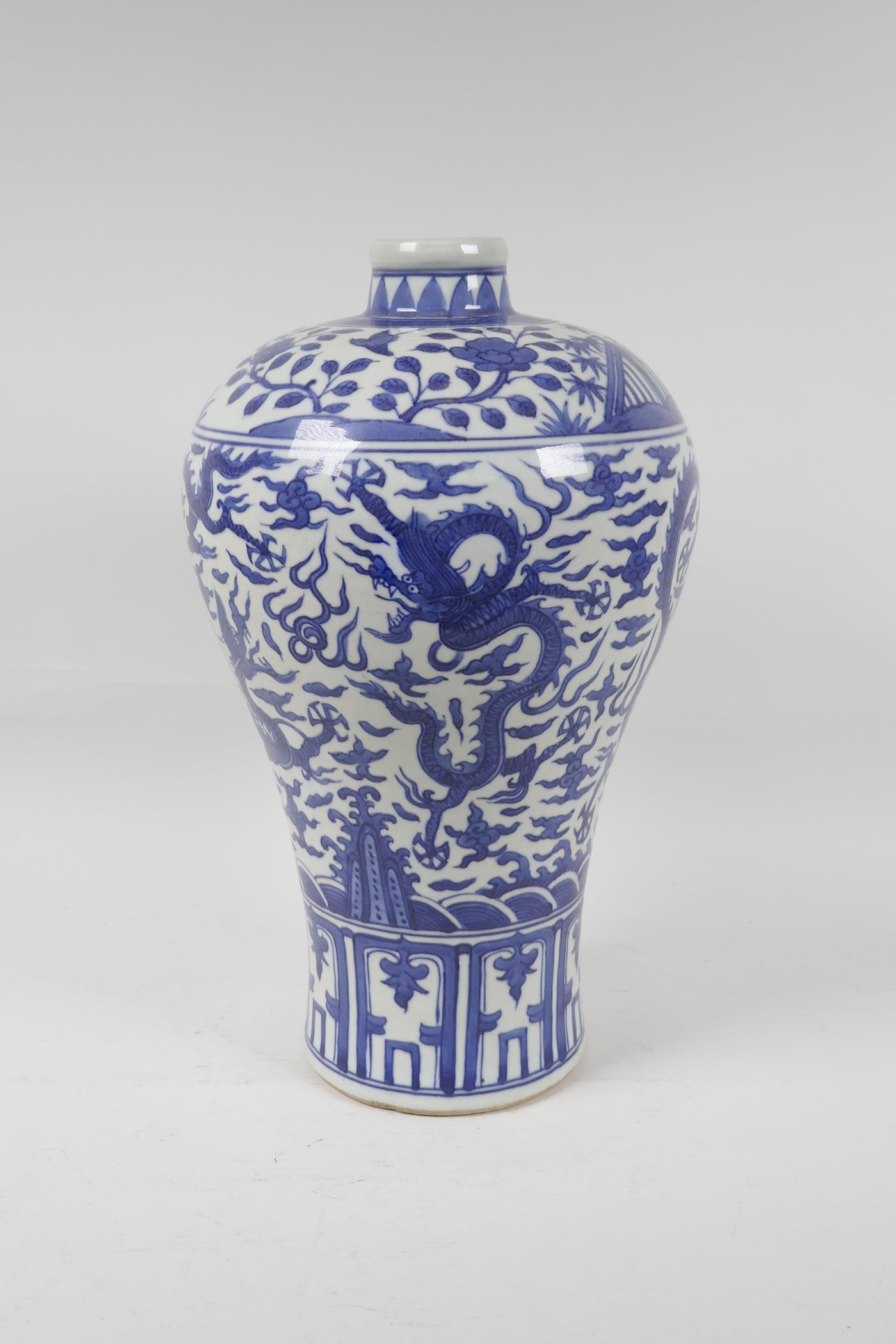 A Chinese blue and white porcelain meiping vase decorated with dragons and character inscriptions,