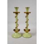 A pair of Bilston enamel candle sticks, the stem entwined with gilt metal ropework, 11½" high