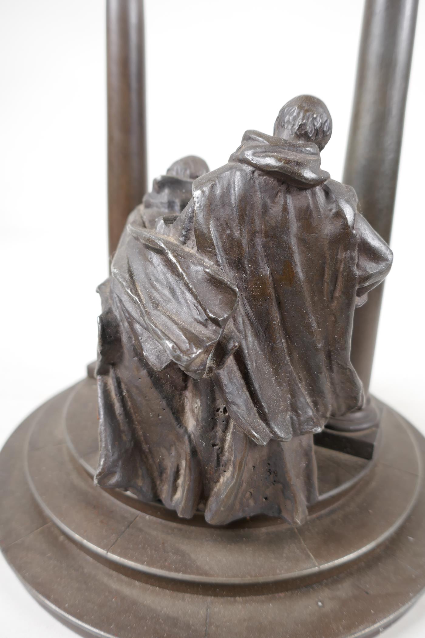 A bronze stand cast as two classical figures looking into a well, 10" diameter, 11" high - Image 4 of 6