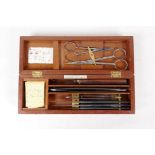 A field surgeons kit by Arnold & Sons, London, for Clive & Co, containing scalpels, a cut throat,