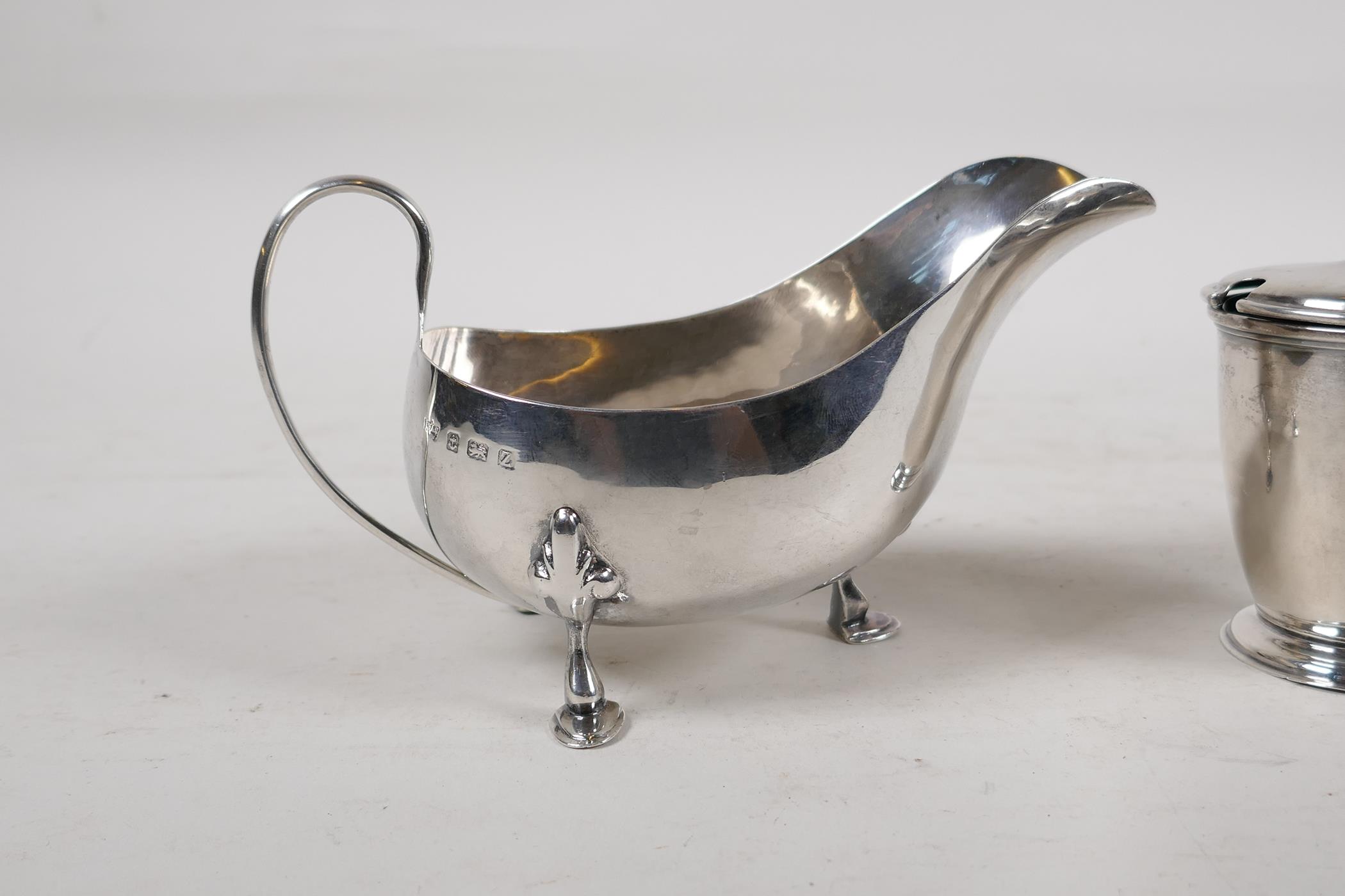 A hallmarked silver sauce boat, Birmingham 1924, and a silver mustard pot with blue glass liner, - Image 2 of 6