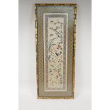 A Chinese silk embroidery of an asiatic bird, flowers and butterfiles, 10½" x 23½"