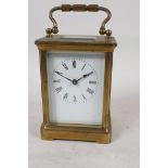 A French brass cased carriage clock by R & Co, Paris, with white enamel dial and Roman numerals, 4½"
