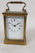 A French brass cased carriage clock by R & Co, Paris, with white enamel dial and Roman numerals, 4½"