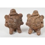 A pair of Andean terra cotta whistles moulded as animals, 4½" high