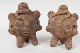 A pair of Andean terra cotta whistles moulded as animals, 4½" high