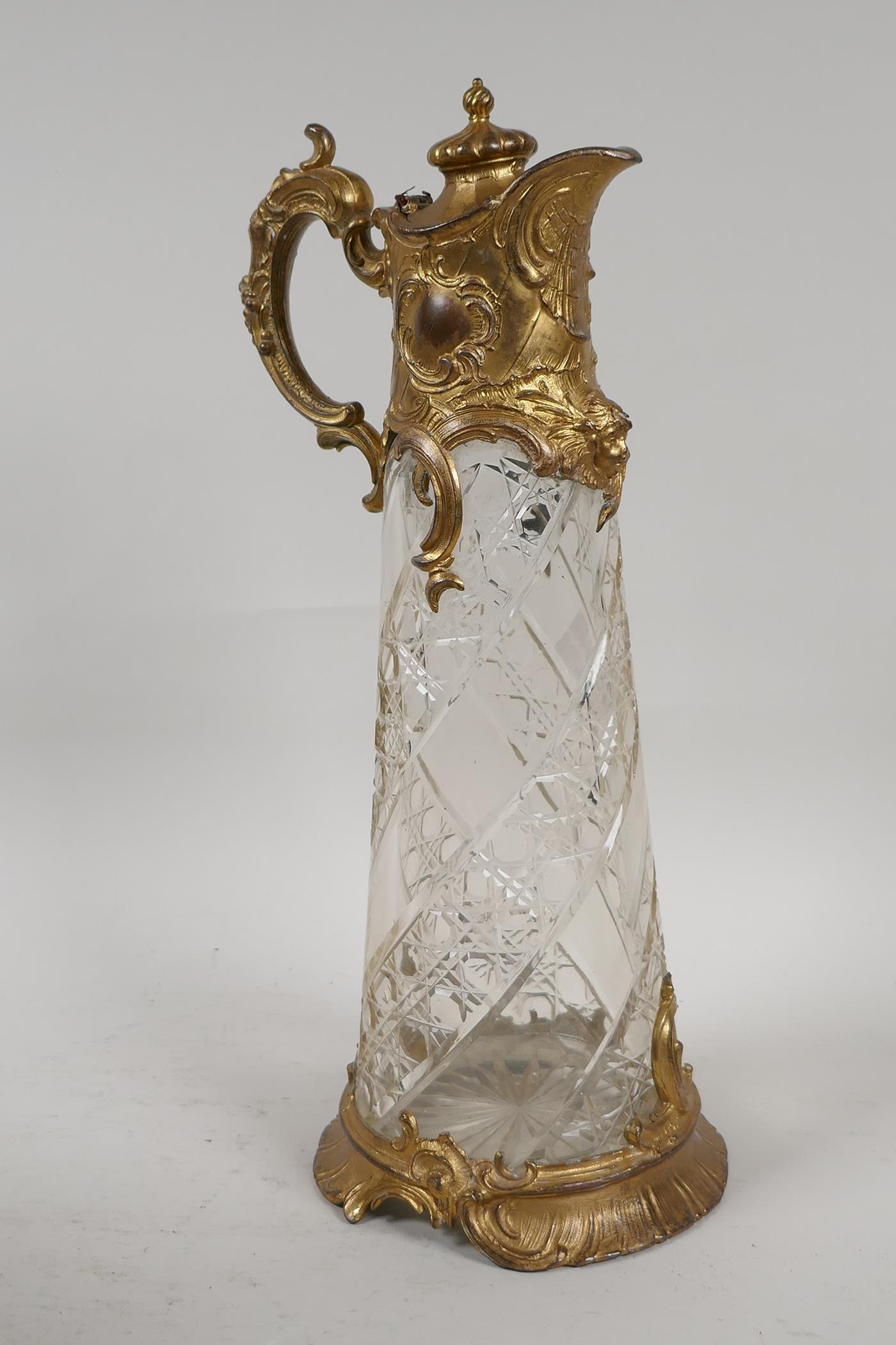 A C19th gilt metal and cut glass claret jug, 12" high - Image 2 of 3