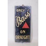 A glass and slate 'Bass' beer advertising sign, 13" x 30"