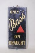 A glass and slate 'Bass' beer advertising sign, 13" x 30"