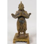 A Sino Tibetan gilt bronze figure of Buddha, 9" high