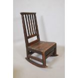 An C18th elm ladderback rocking chair