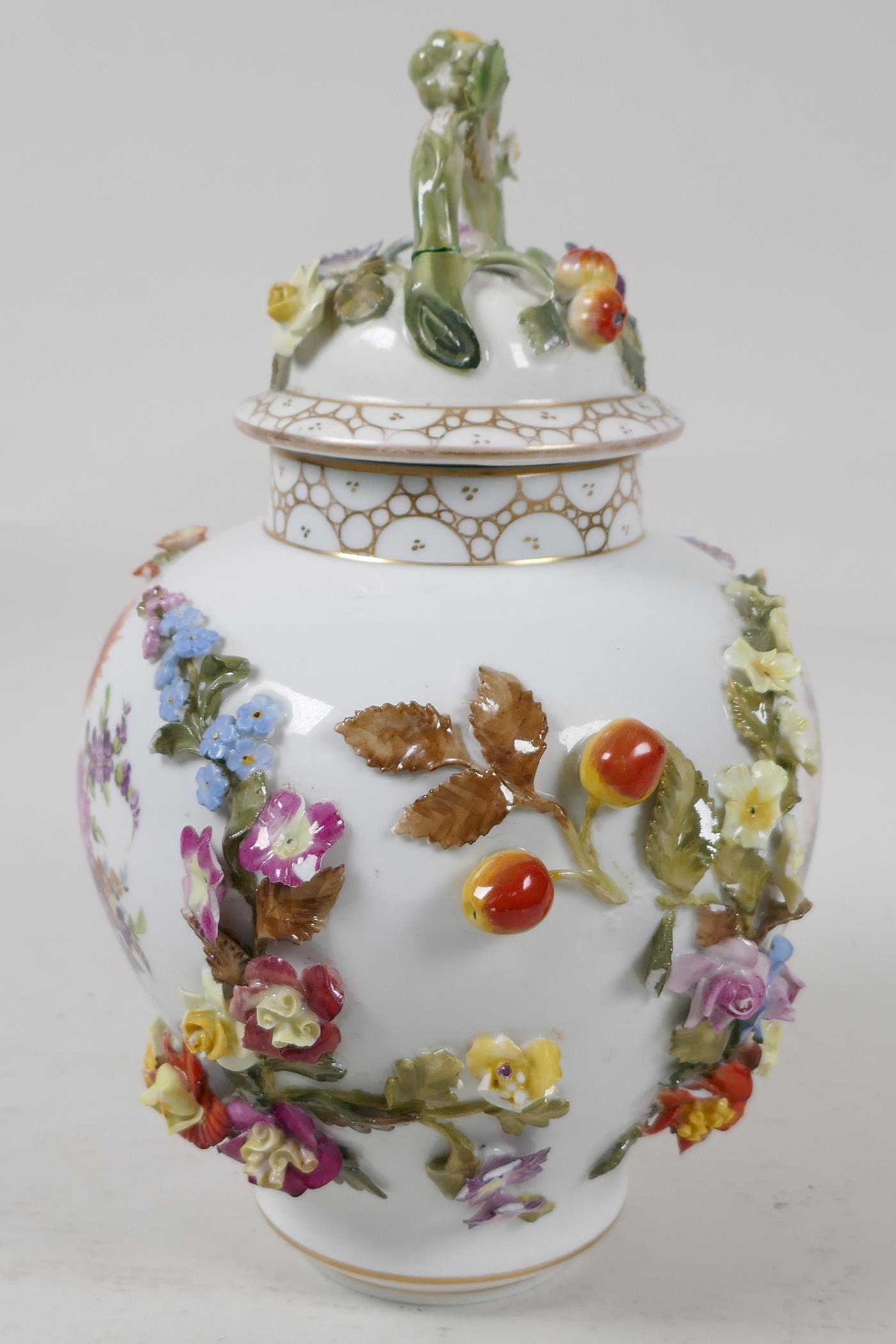A German porcelain vase and cover, decorated with a courting couple, and encrusted with fruit and - Image 2 of 4