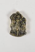 A brass vesta case with raised decoration of three semi clad women, 1½" x 2"