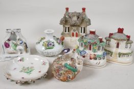 Three Staffordshire cottage pastile burners, a bird nest and snake pastile holder, a Fairing '12
