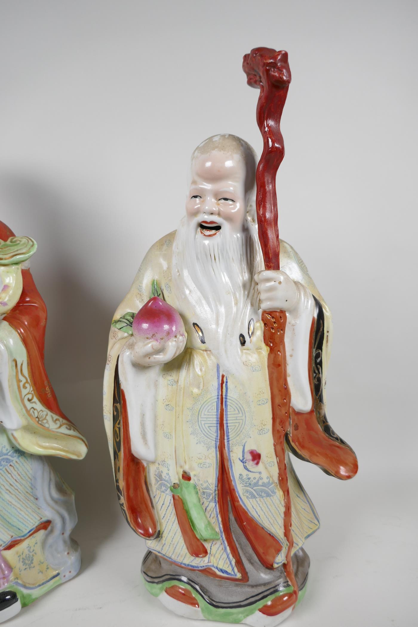 A Chinese porcelain figure of a dignitary with a bejewelled ruyi, painted in bright enamels, 15" - Image 3 of 7