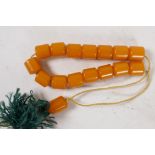 A string of butterscotch amber beads, each approx 10mm diameter, 21g total