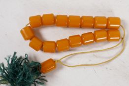 A string of butterscotch amber beads, each approx 10mm diameter, 21g total