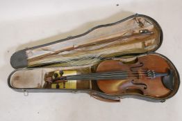A vintage violin and bow in case, 14½" back including button, 23½" long