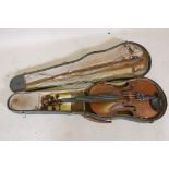 A vintage violin and bow in case, 14½" back including button, 23½" long