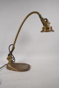 An early C20th adjustable brass bench/desk lamp, bears registration number 734123/4