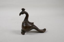 A Murghal bronze figure of a peacock, 4½" long