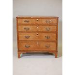 A Regency inlaid oak chest of four graduated drawers, 34" x 17½", 34½" high