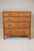 A Regency inlaid oak chest of four graduated drawers, 34" x 17½", 34½" high