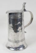 A C19th French polished pewter cider tankard, engraved with an inscription dated 1882, 10" high