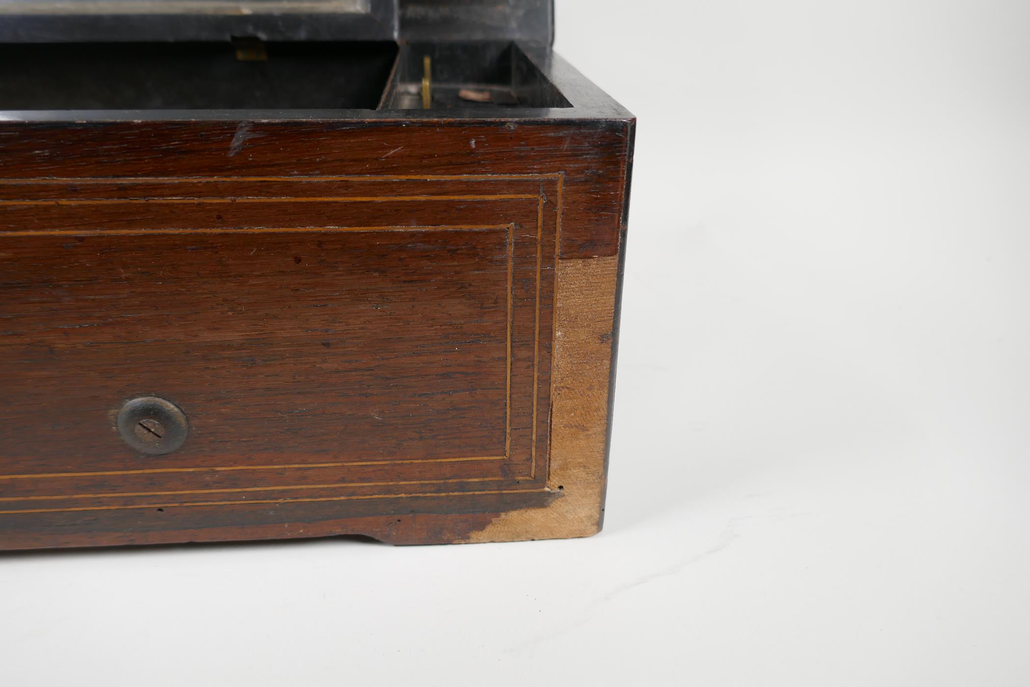 A C19th Swiss rosewood veneered music box with cross banded inlay, playing 6 aires, lacks melody - Image 5 of 6