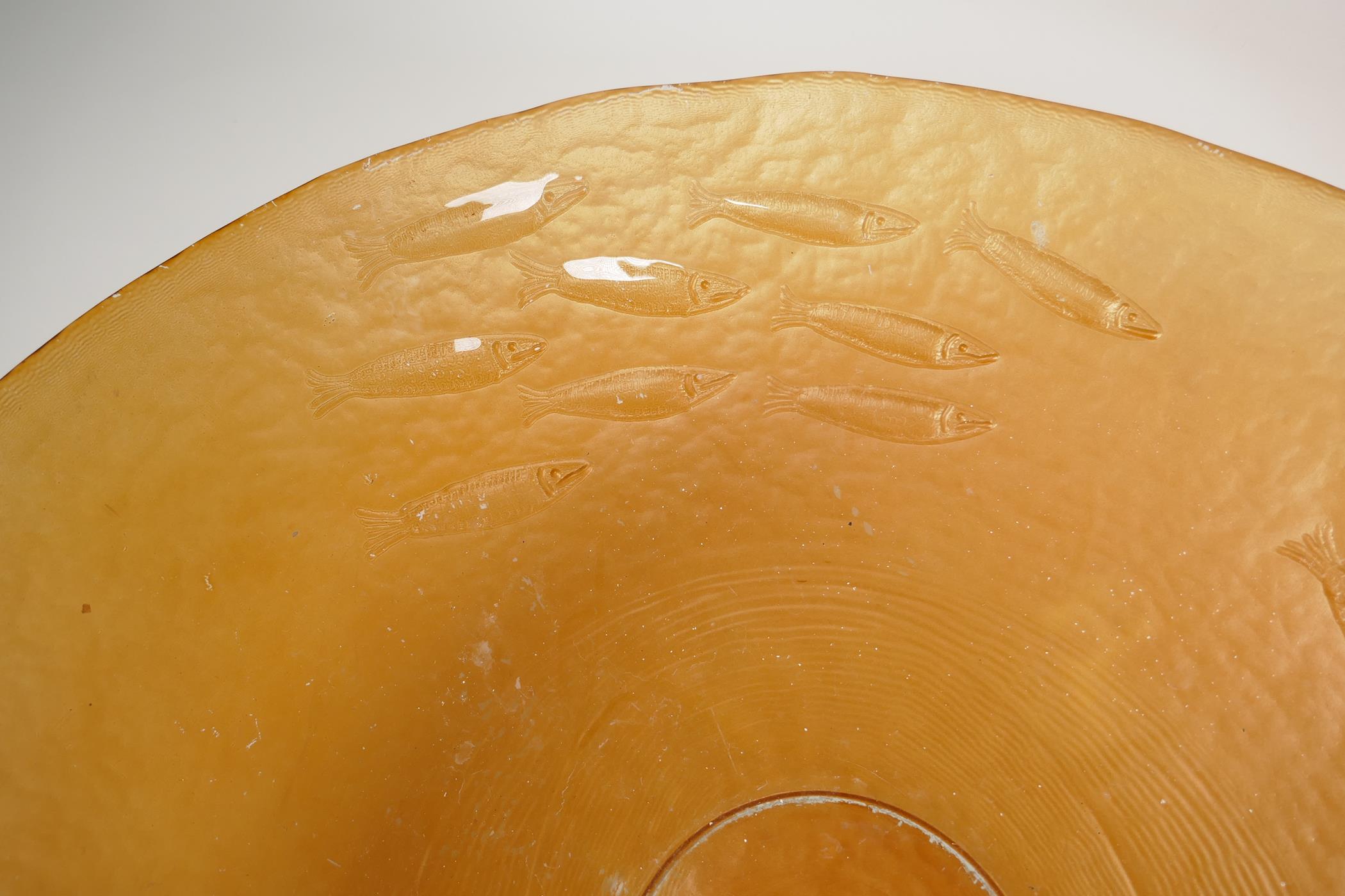 A large amber glass centrepiece bowl, embossed with a shoal of fish, 19" diameter - Image 2 of 4