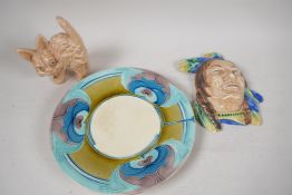 A Minton Secessionist ware stand, 9" diameter, an Art Deco pottery Native American wall mask and a